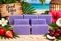 Tropical Crush purple handmade soap bars with strawberry, coconut, cherry, and tropical beach background